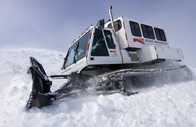 Snowcat used by MWO staff during the winter months, shown atop a tall snow drift